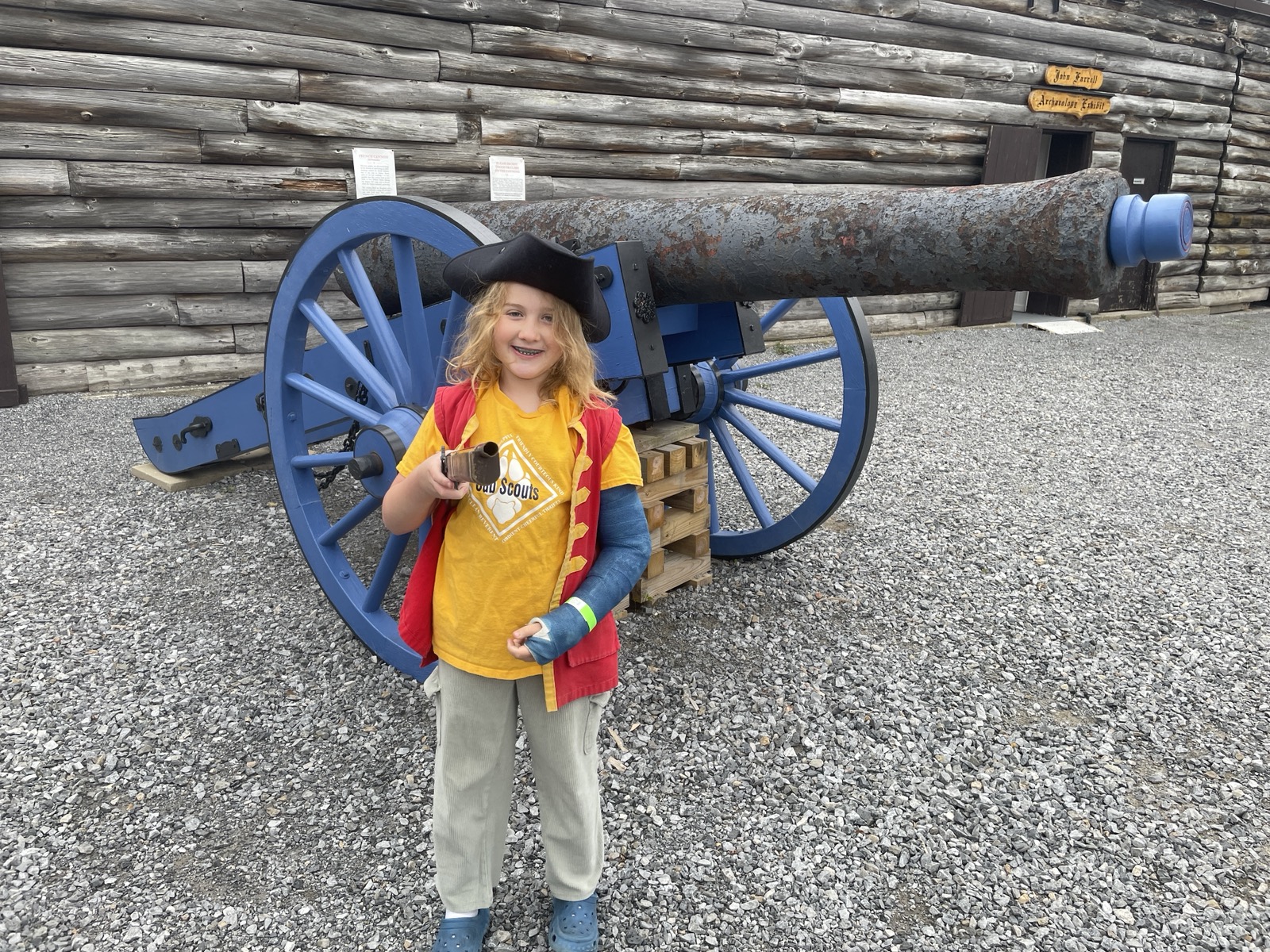 A young Scout at a historic cannon, learning about local history.